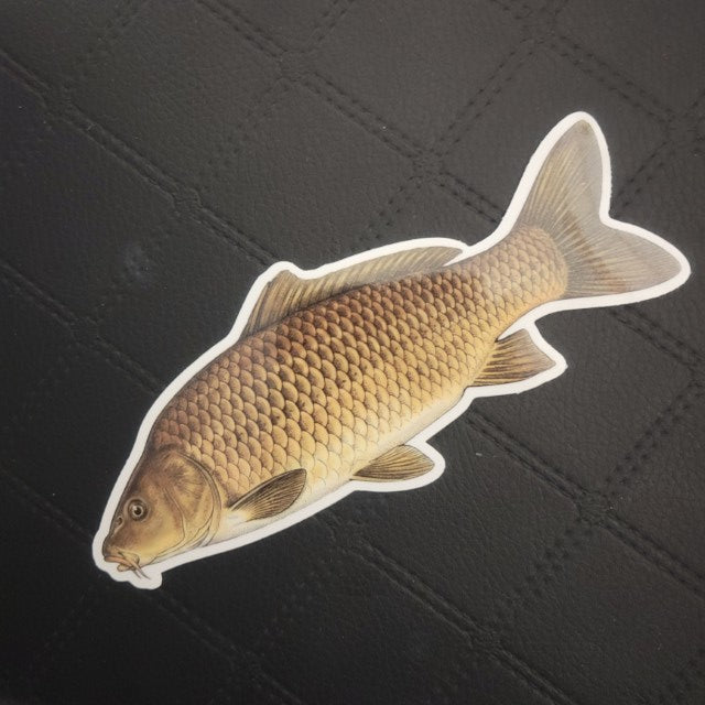 Realistic brown fish vinyl die cut sticker by InkBird Print Studio, with glossy adhesive, shown on luxe black diamond-stitched fabric. Printed for Good Days Marina