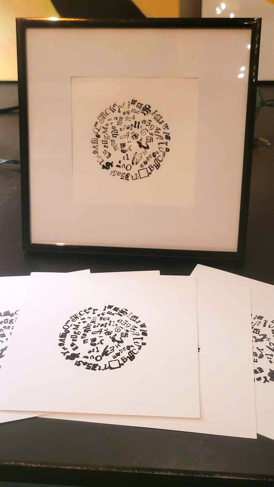 Letterpress Circle wall art print by Claire Davis—black ink on white heavyweight paper, features unique typographic circle design.