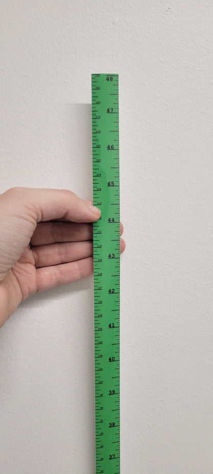InkBird Print Studio vertical adhesive vinyl ruler in white, showing 41–48 cm, clear bottom-to-top markings, held on a wall.