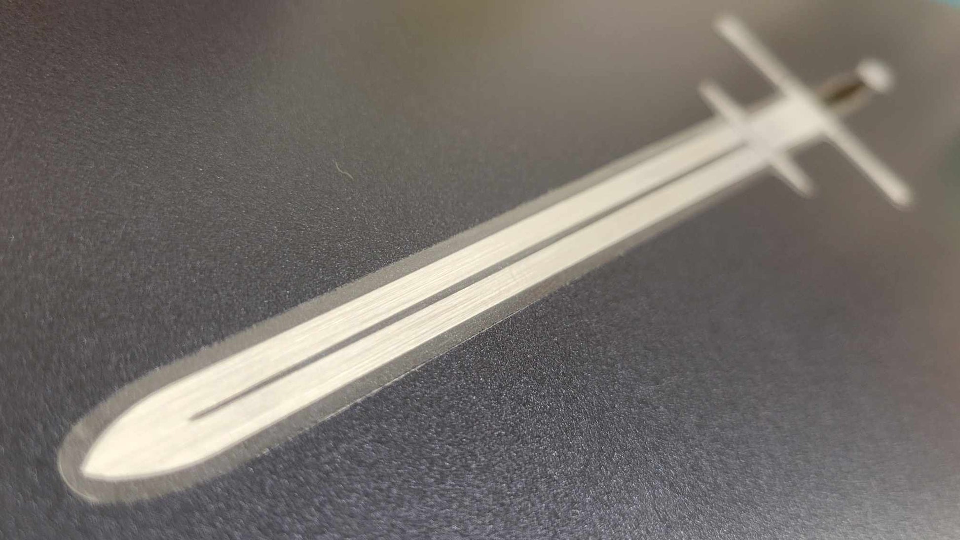 Vinyl Zweihander sword sticker by Chris Luberger of InkBird Print Studio, silver and black foil on matte adhesive; stylized design, durable finish.