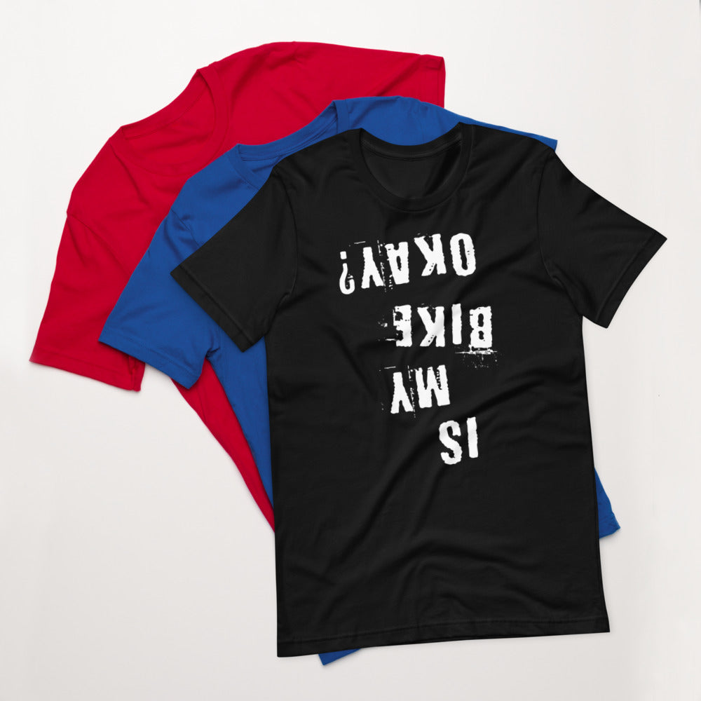 InkBird Print Studio “Is My Bike Okay?” cotton T-shirt, white distressed vinyl text, gray color, S-XL; stacked atop red and blue tees.