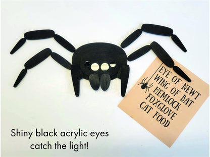 Handcrafted spider magnet with wood body, shiny black acrylic eyes, 4 jointed legs, and strong neodymium magnets; perfect gothic decor.